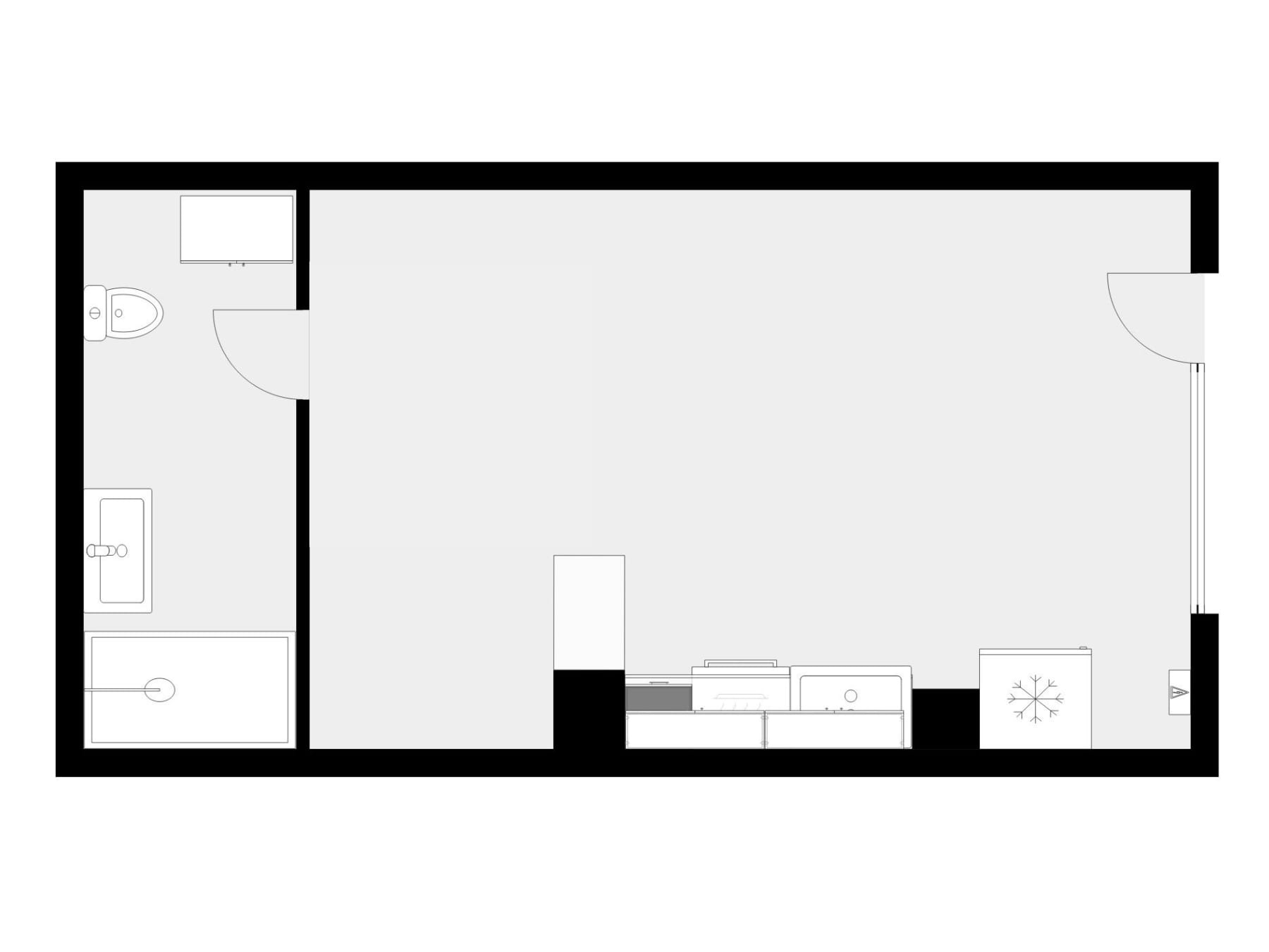 Planta de la vivienda: baño con lavadero a la izquierda, estancia única y cocina en línea al fondo